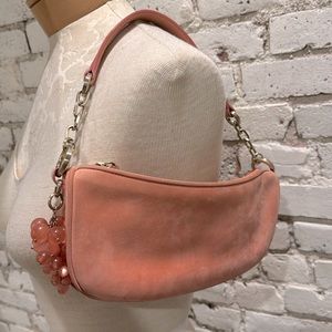 Pink suede purse with beads and brass details